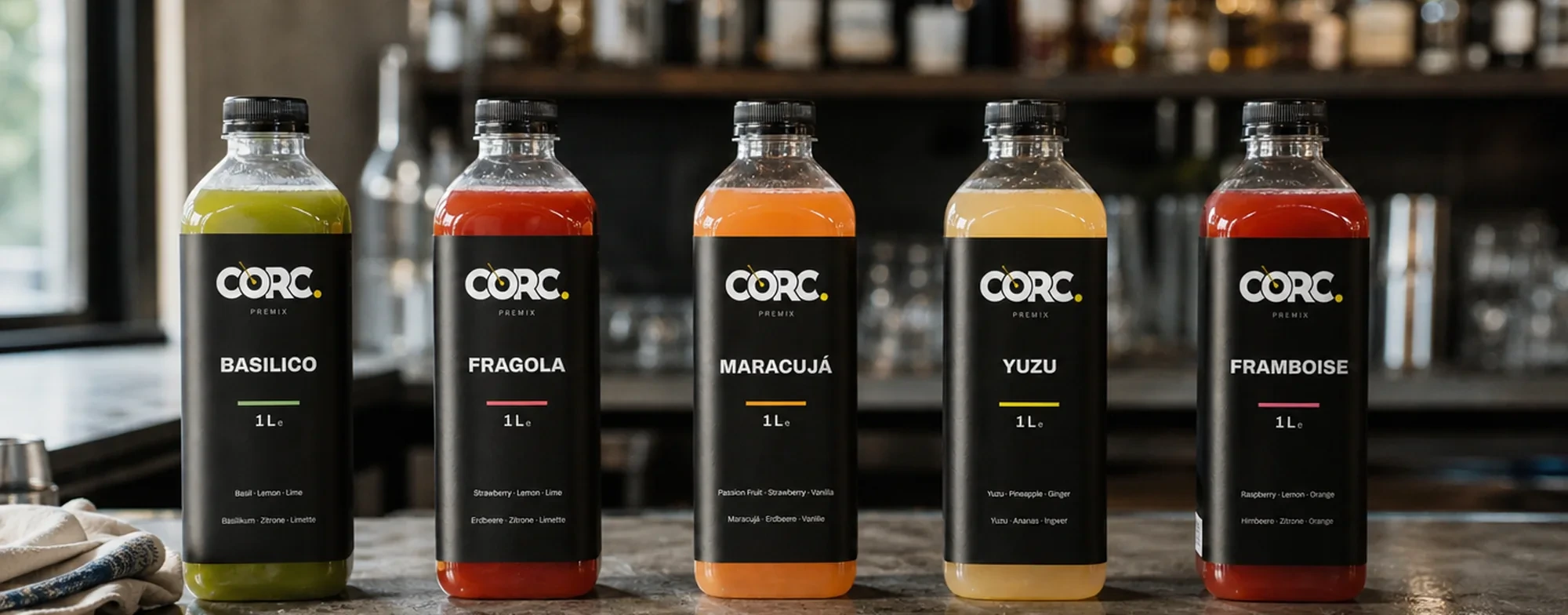 Five CORC bottles lined up on a bar counter