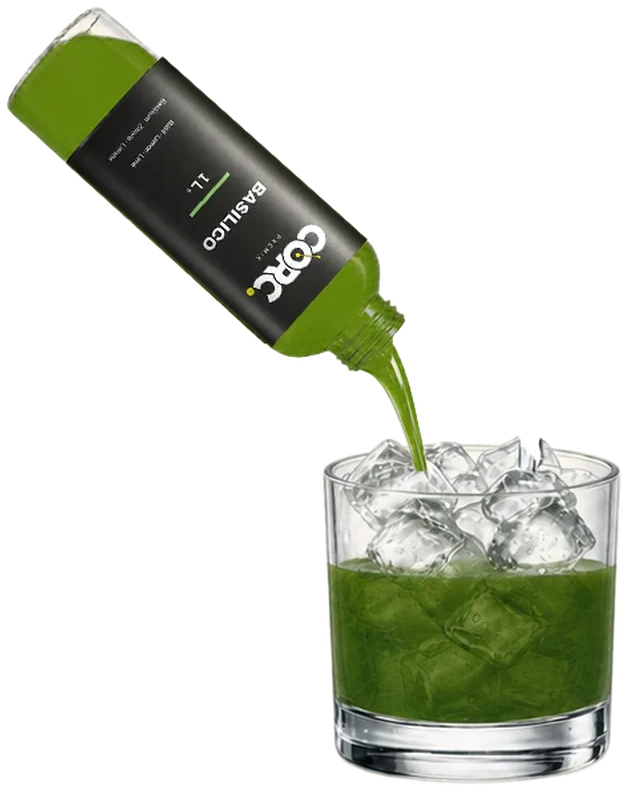 A CORC bottle pouring green base over the ice